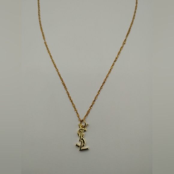 Yves Saint Laurent Jewelry - Yves Saint Laurent Gold Logo Necklace Authentic 2nd Pic Shows Stamp On The Back